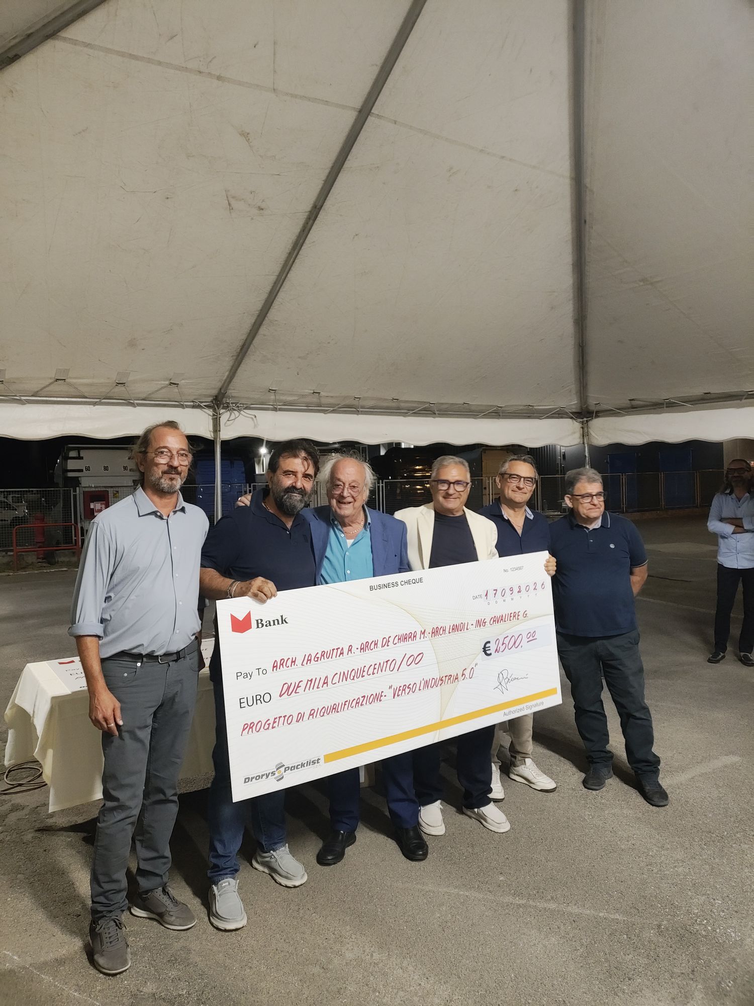 Presentation of the second-place prize check to the design team